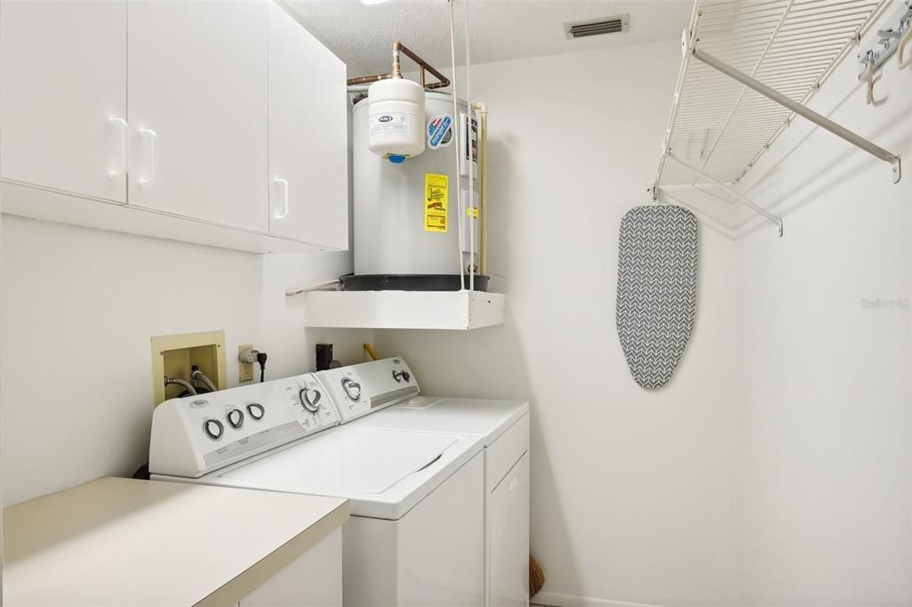 Interior laundry room with storage