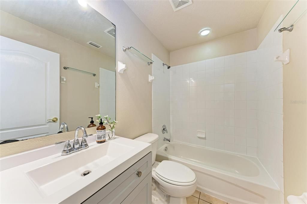 Upstairs bathroom with tub.