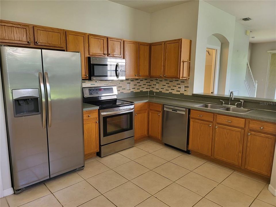 Sink overlooks the breakfast bar and great room with a view to the conservation!