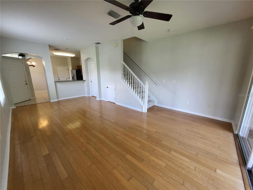 View to front door and kitchen.  Approx 23' from kitchen to sliders.