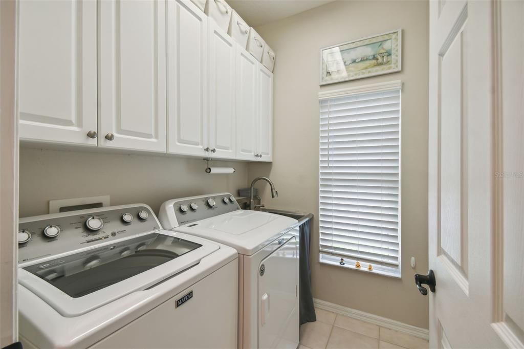 Laundry Room with sink and built-in cabinets