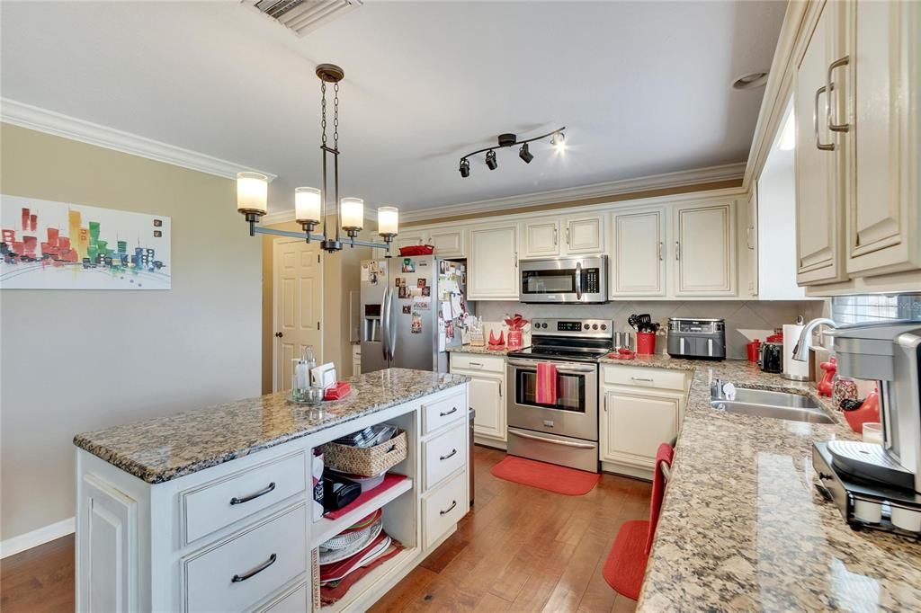 Another view of the kitchen with a pantry closet next to the refrigerator!