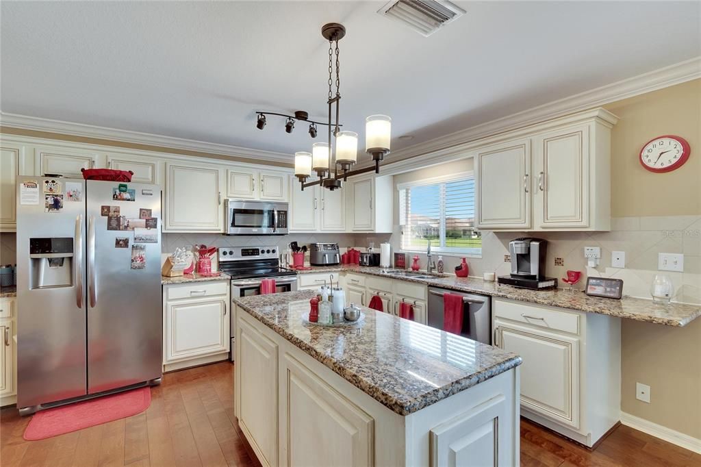 Kitchen with island and steinless steel appliances!