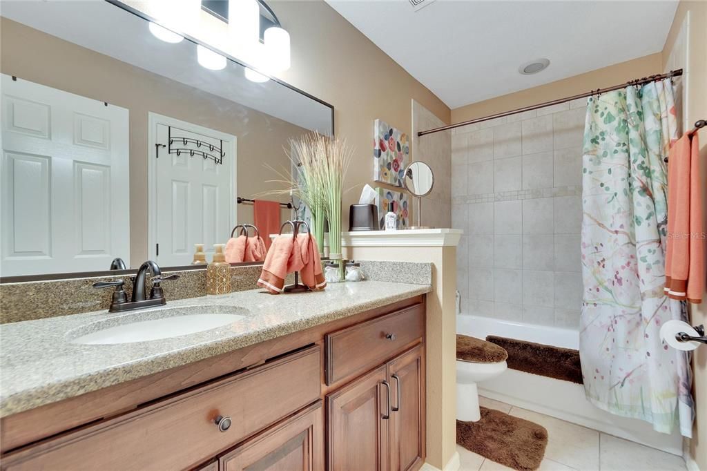 Guest bathroom with tiled tub shower!