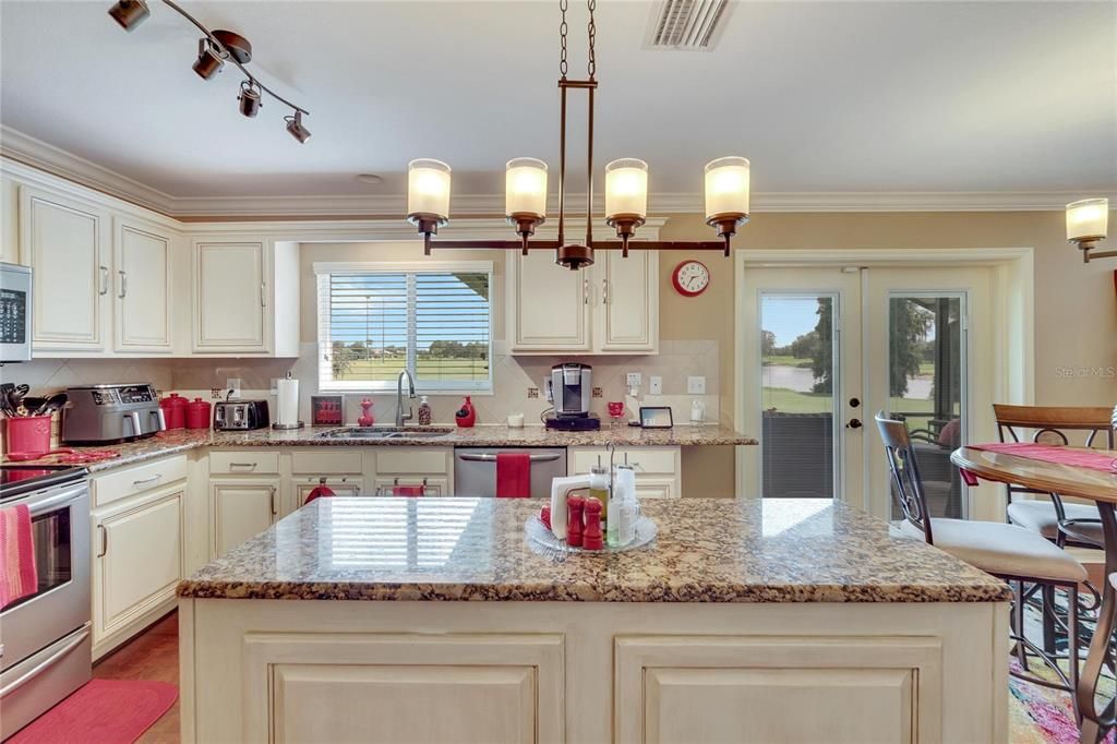 Kitchen with view of the golf course and lake/pond!