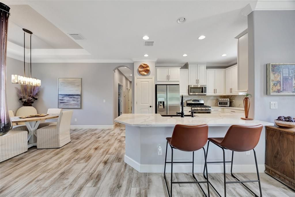 Inviting island sitting with quartz counters