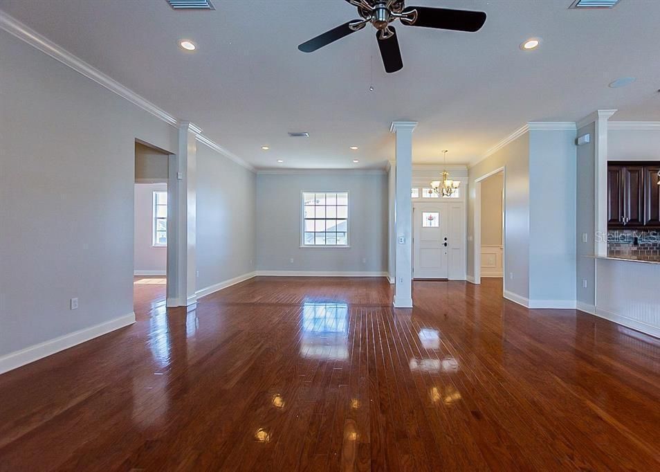 LIVING ROOM DINING ROOM COMBO WITH REAL WOOD FLOORS AND OPENS TO KITCHEN AREA