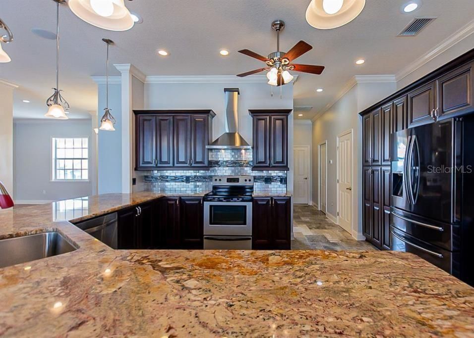 KITCHEN WITH AMAZING GRANITE AND CUSTOM WOOD CABINETS