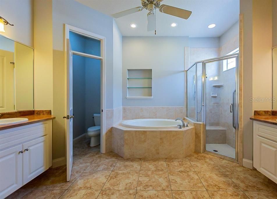 MASTER BATHROOM WITH SOAKING TUB AND HIS AND HER SINKS