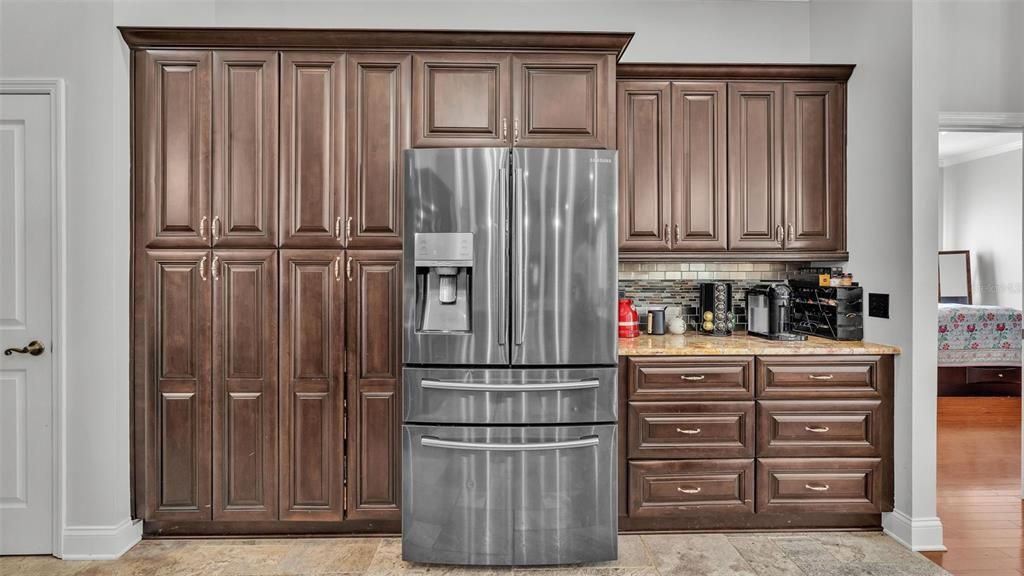 tons of wood cabinets in the kitchen