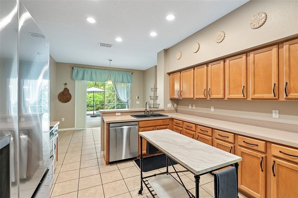 Kitchen features maple cabinets with hardware, and plenty of counter space