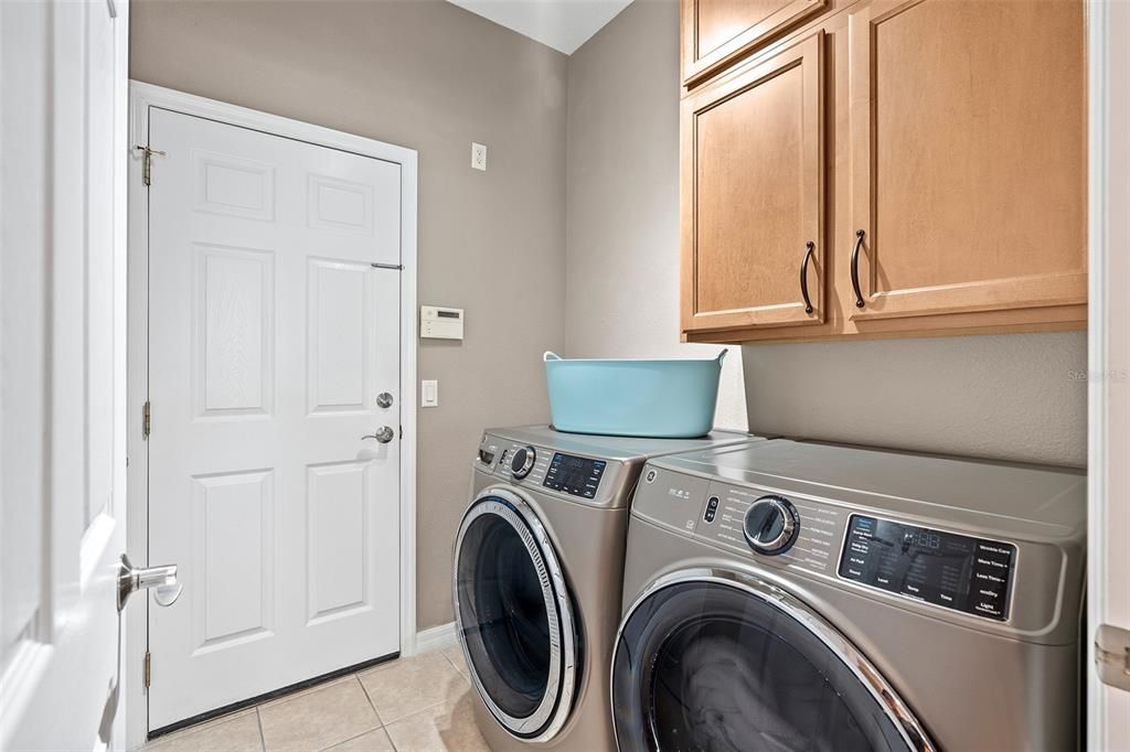 Cabinets and an unfinished closet for additional storage