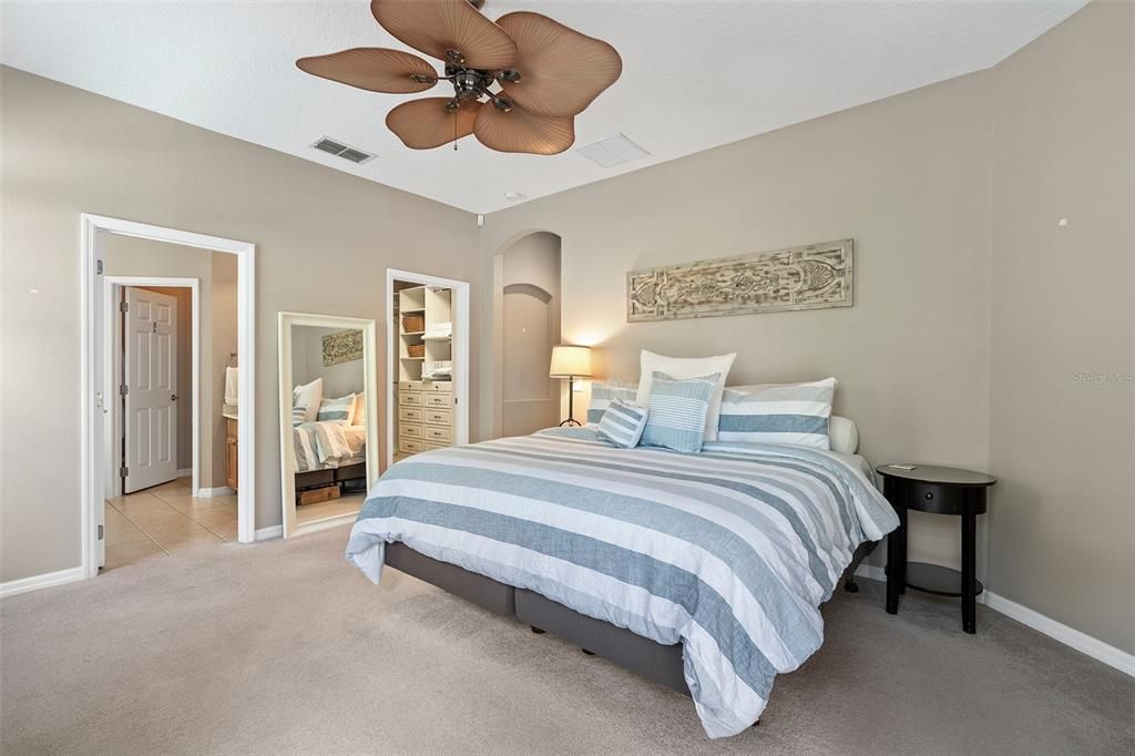 View to an ensuite bathroom and custom walk-in closet