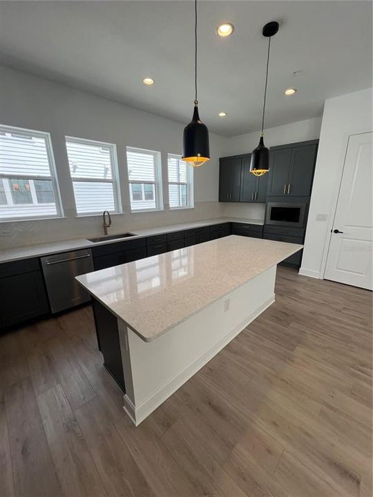 Kitchen - upgraded quartz, countertops and backsplash