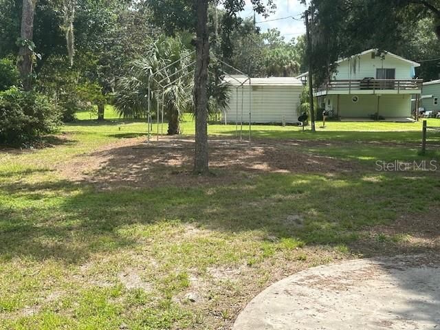 Single lot next to house