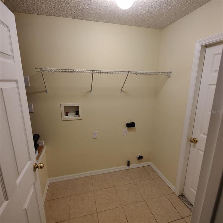 Laundry and utility room.  Dryer can be either gas or electric