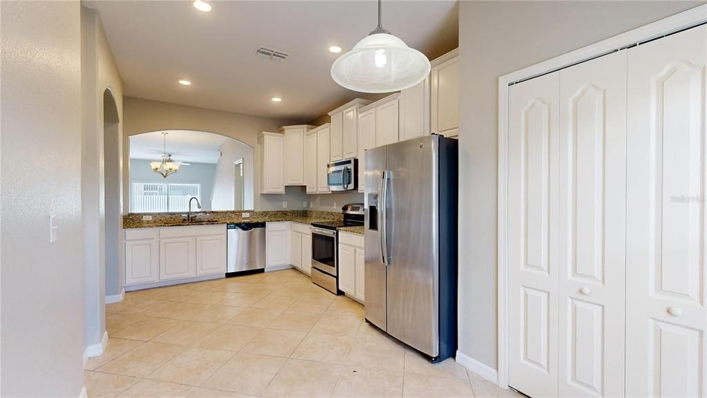 View of kitchen from family room area.