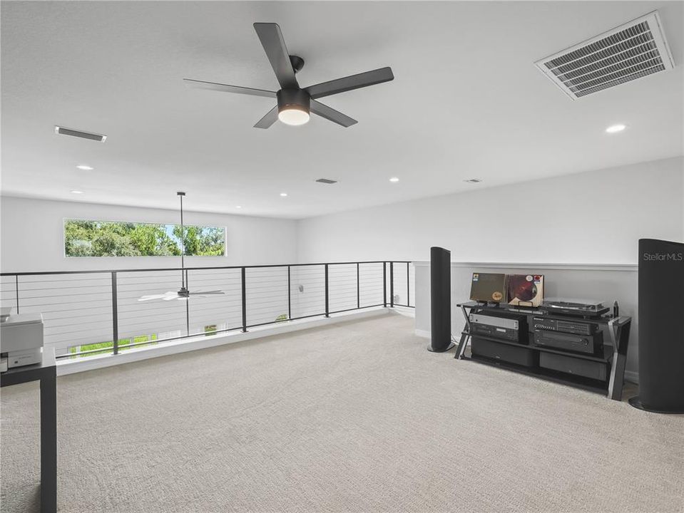 Loft Area with Custom Railing and Ceiling Fan