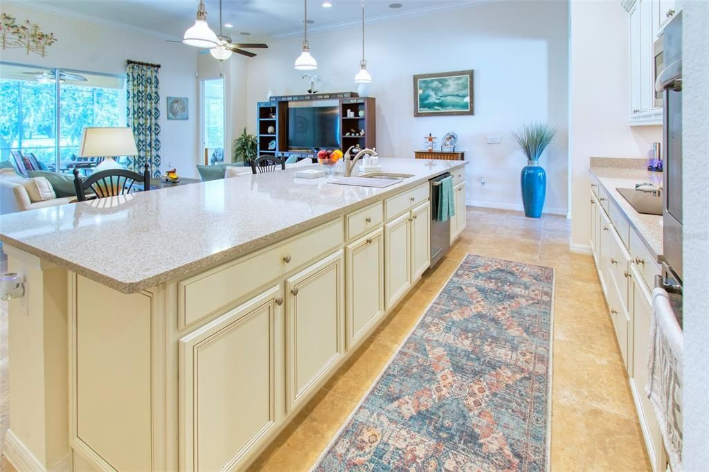 The island is HUGE! Cabinets are an up-level color in cream with a copper glaze highlighting the details