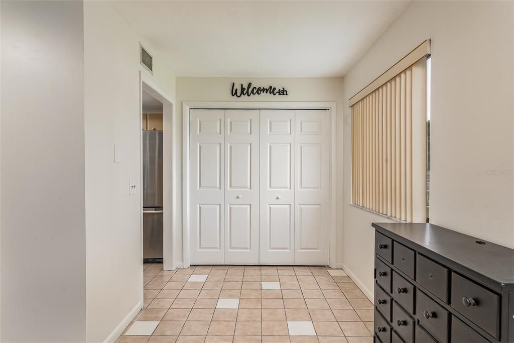 Laundry area behind the closet doors , dinette space off kitchen