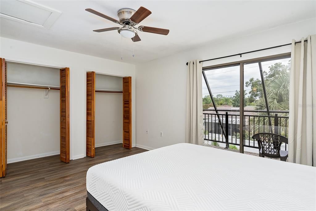 Primary Bedroom with double closets and balcony view!