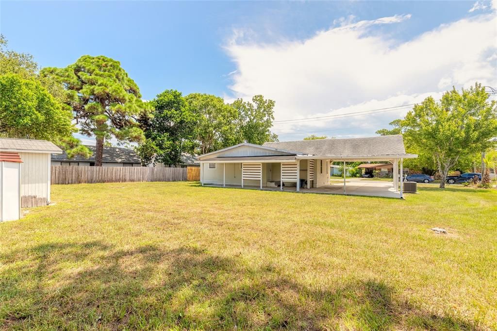 Backyard with 2 storage Sheds