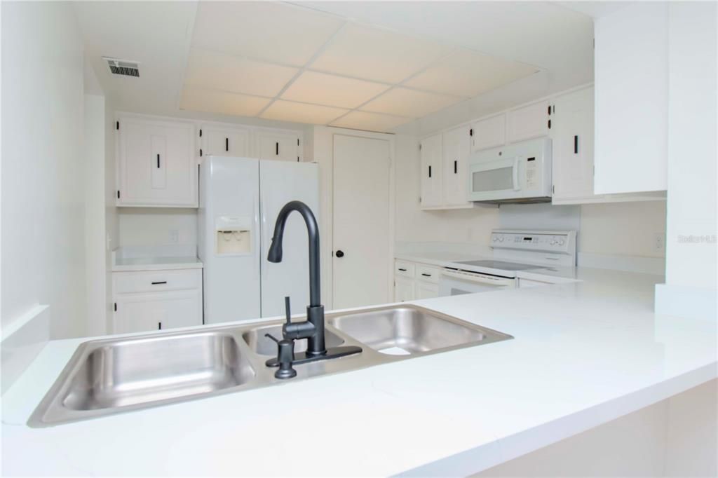 Kitchen and counter view from dining room