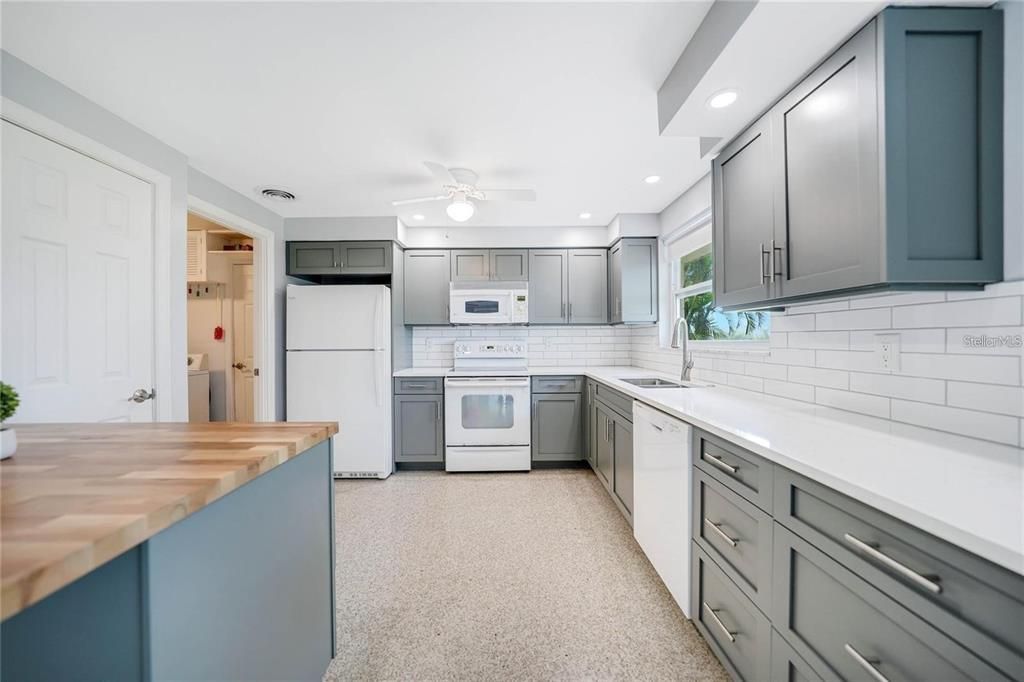 Kitchen complete with stylish subway tiles and breakfast bar.