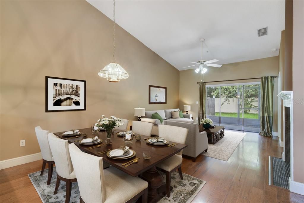 TRIPLE SLIDING GLASS DOORS let the light pour in and give you access to the screened lanai. Virtually Staged.