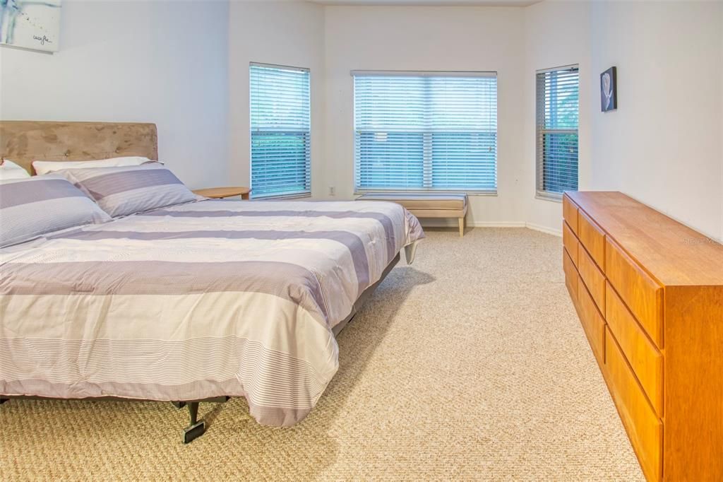 The owners suite occupies it's own portion of the home - this room has the optional bay, along with walk-in closet, linen closet and en-suite.