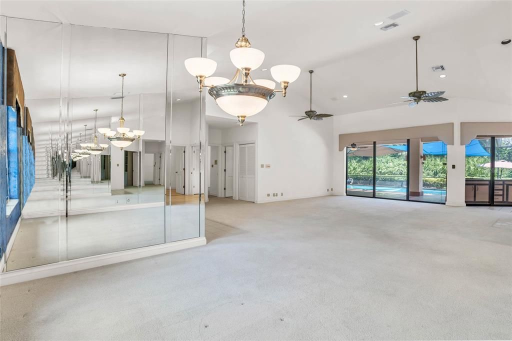 Spacious living area with vaulted ceilings and natural light