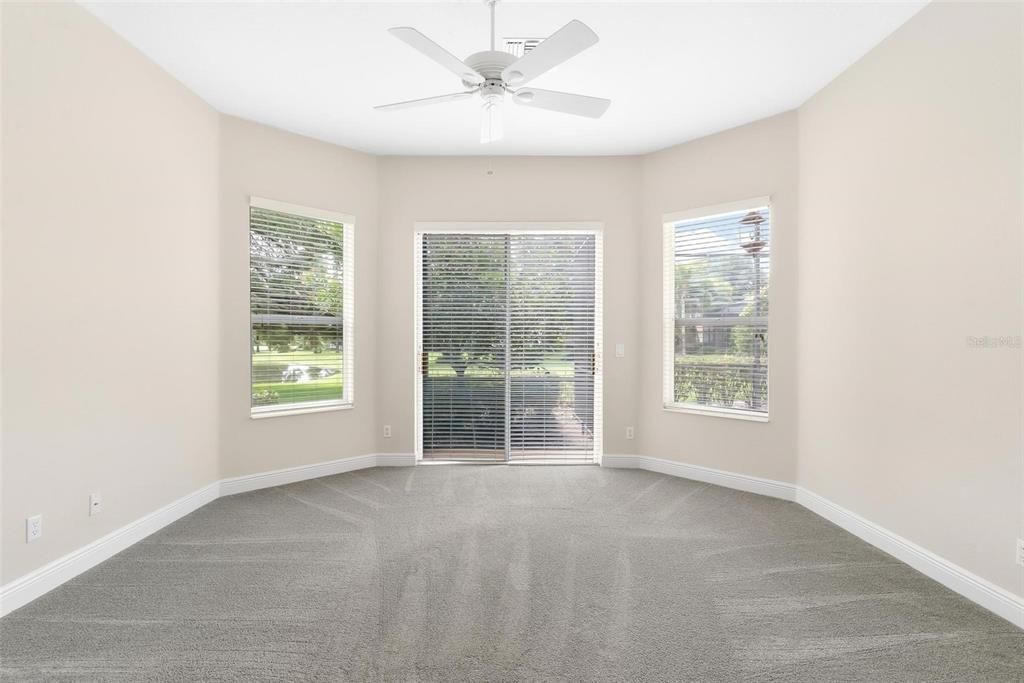 Primary Bedroom with Sliding Doors leading to Backyard Area