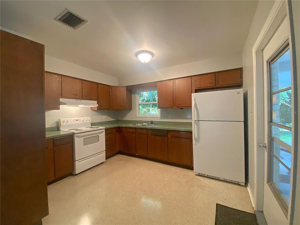 Open kitchen with solid wood cabinets