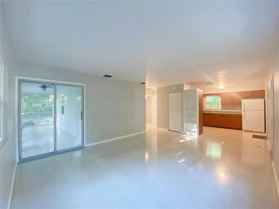 Open living room with sliding doors to the lanai