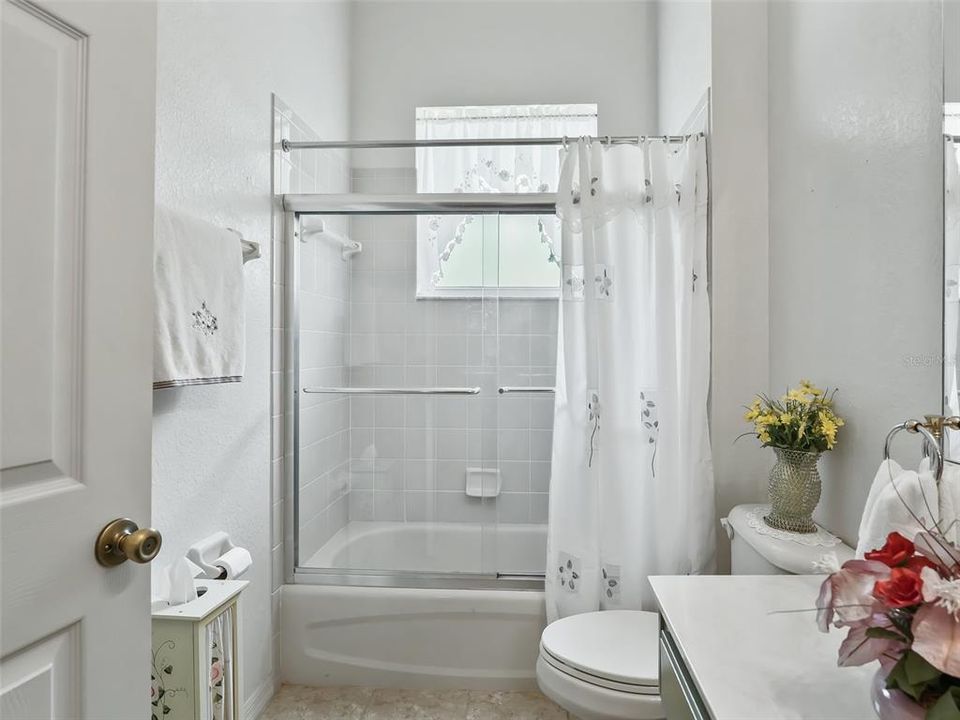 Guest bathroom w/Tiled tub & shower combination