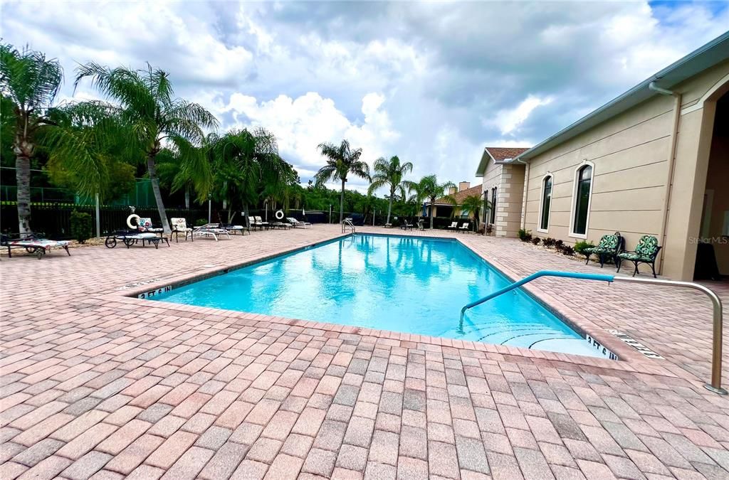 community pool w/ lots of patio/lounging areas