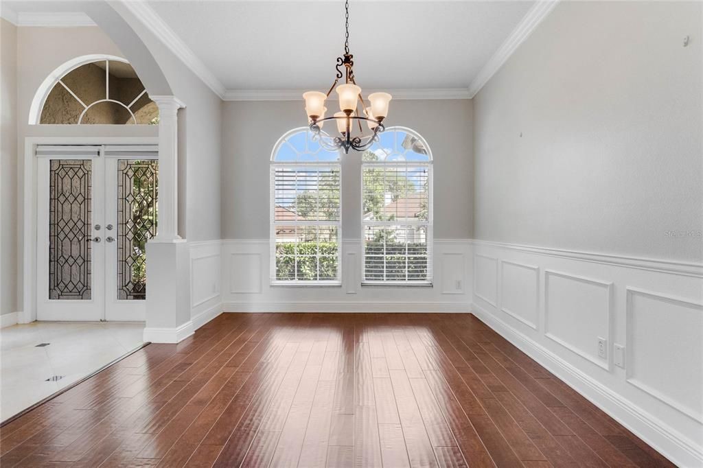 Wood flooring that flows through the formal living and dining room