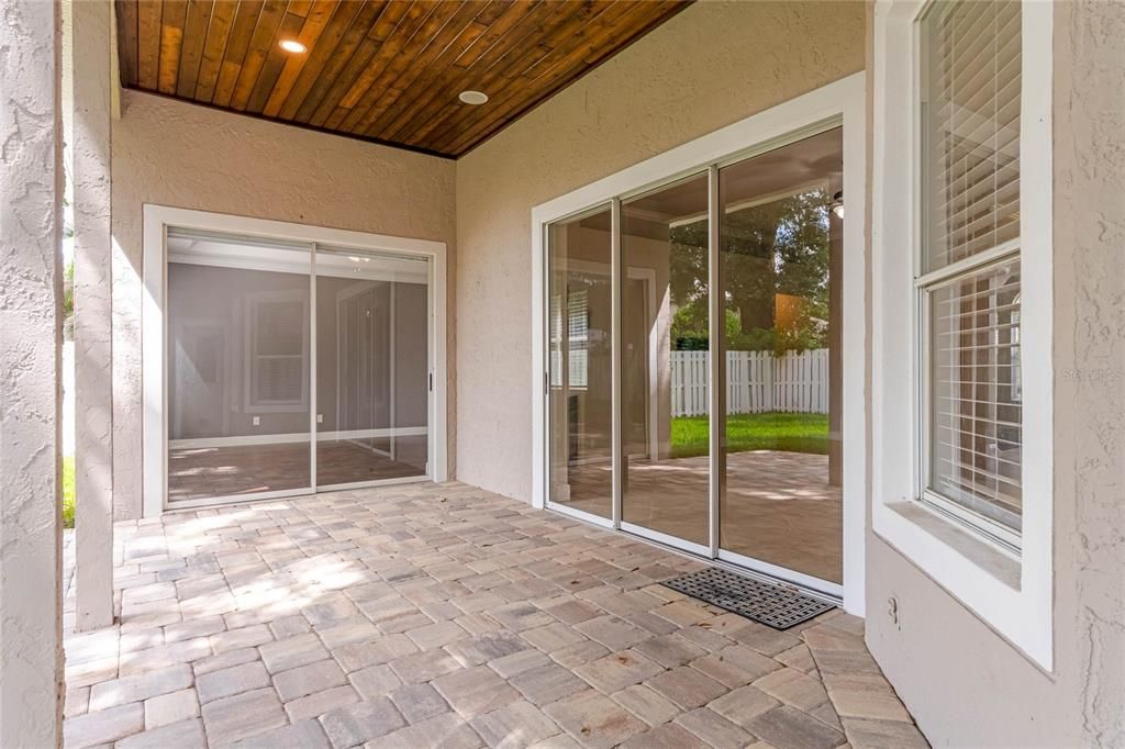 Outside is the lanai with a stunning tongue-and-groove ceiling