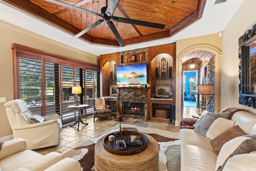 Family Room with Wood Fireplace & Plantation Shutters