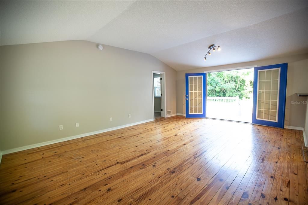 Living Room w French Doors leading to rear patio