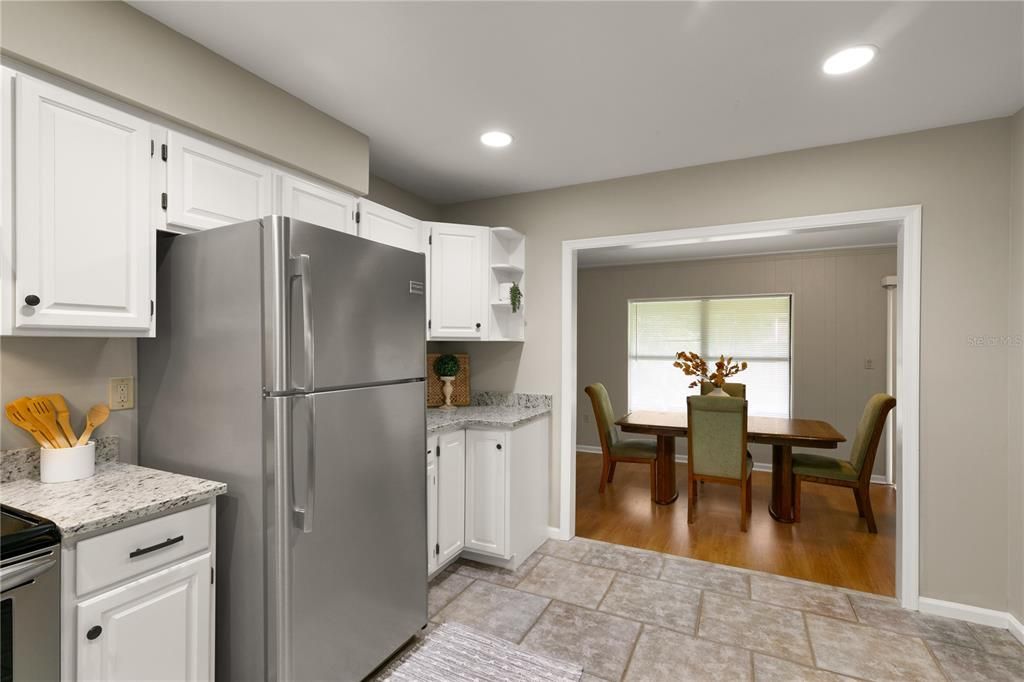 11x14 Tiled Kitchen opens to the Dining Room.