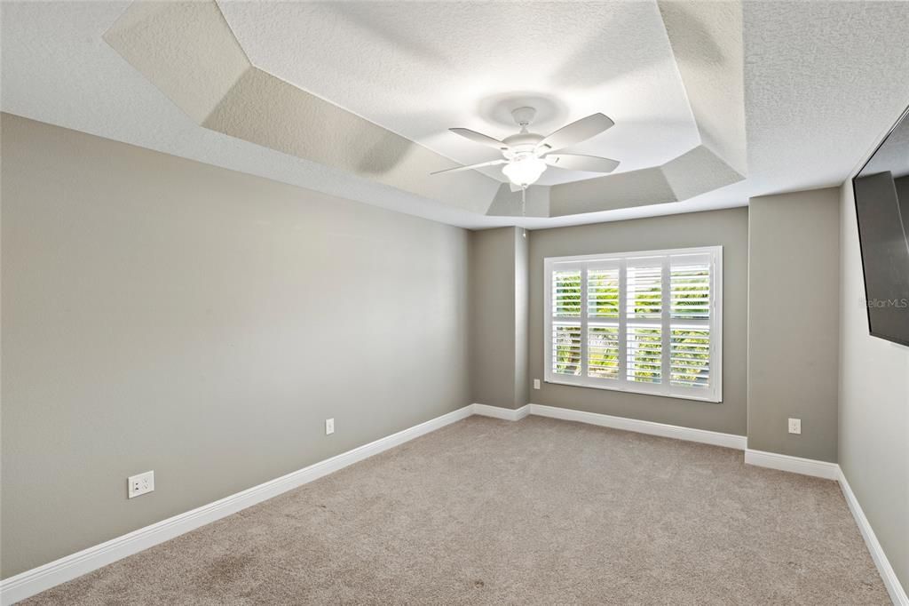 Bedroom 2- Tray Ceilings, Plantation Shutters, Built-In Closet