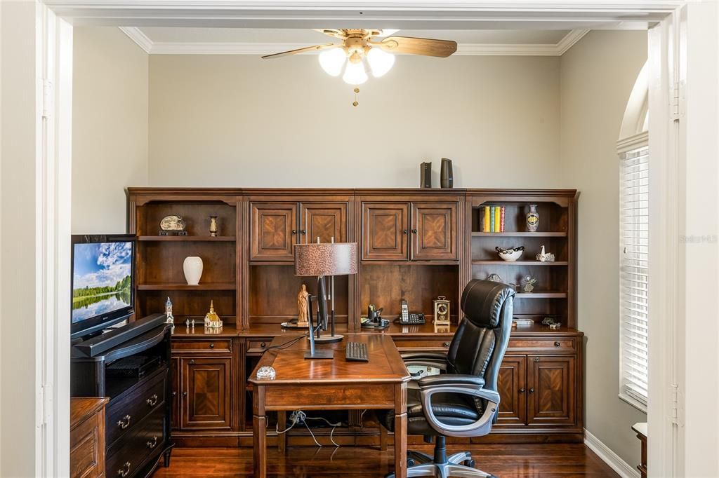 office that features wood laminate floors