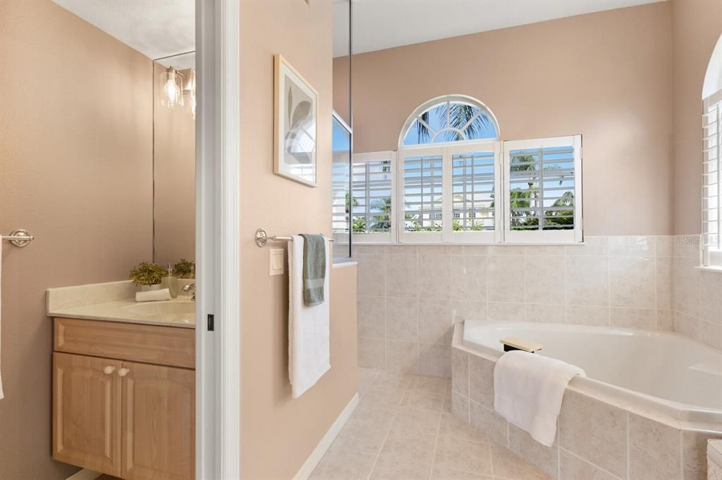 Primary bathroom with separate sink in water closet