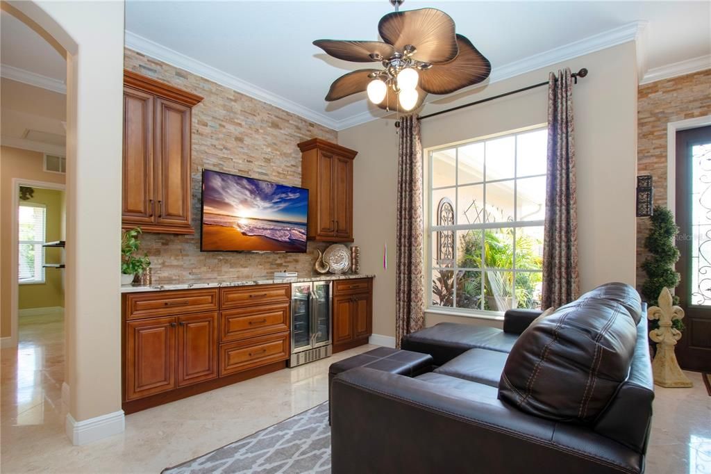 Formal dining room, currently being utilized as a lounge/extra seating area