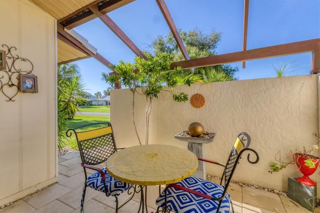 beautiful courtyard off dining area that provides privacy & yet another space to entertain in