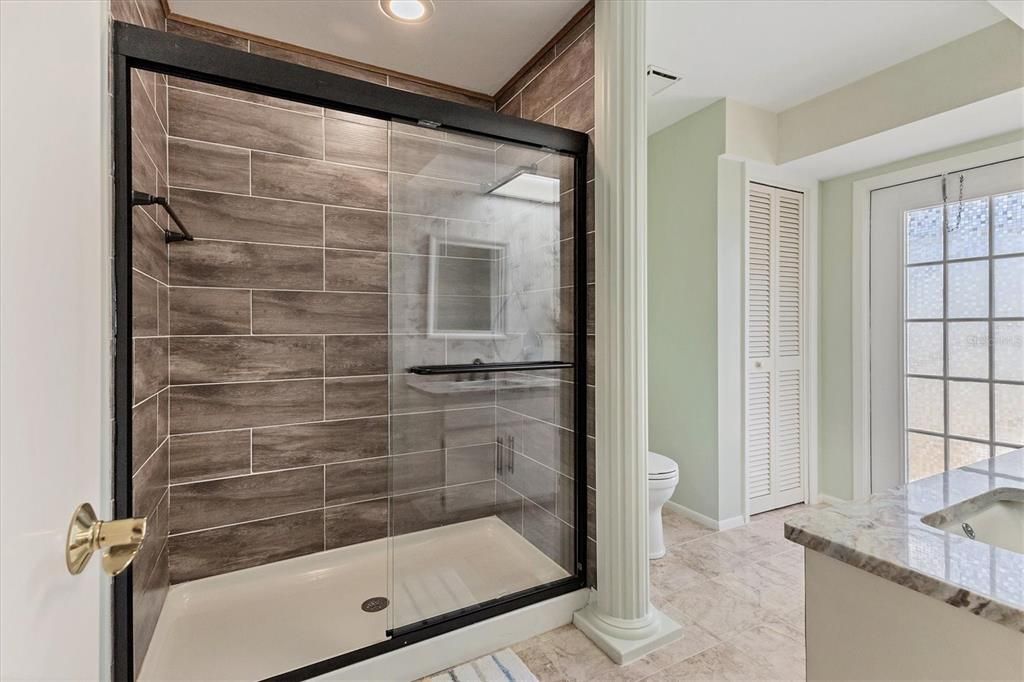 updated walk-in spa-like shower & lots of natural lighting