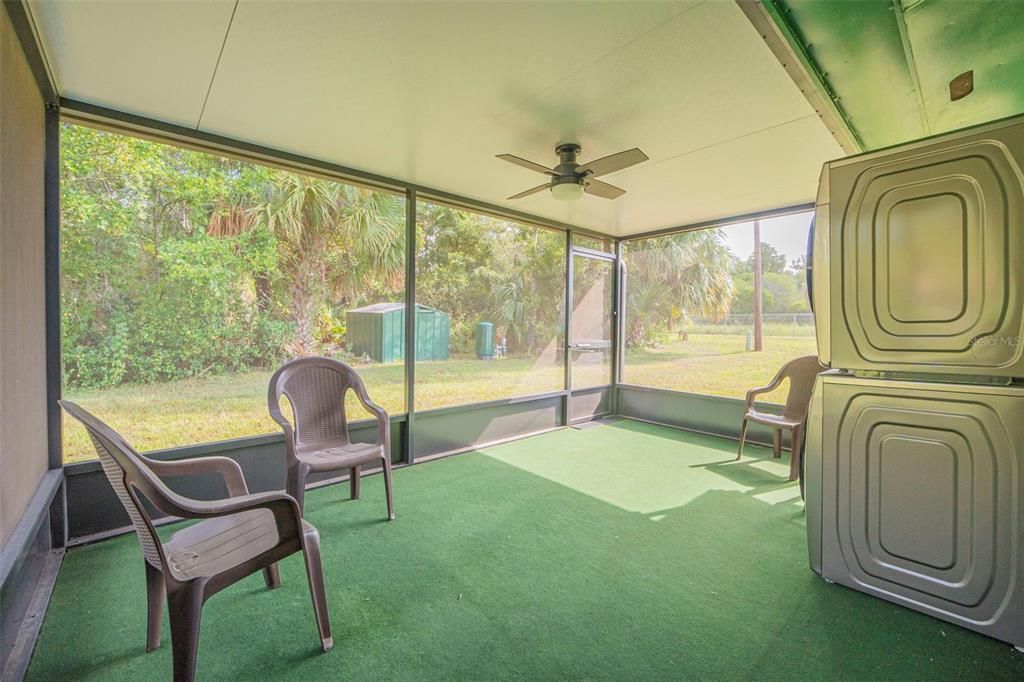 Enjoy your private backyard oasis in the screened in porch.