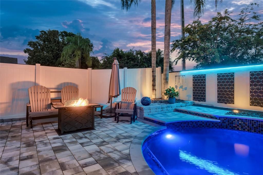 salt water pool with lighting and water features