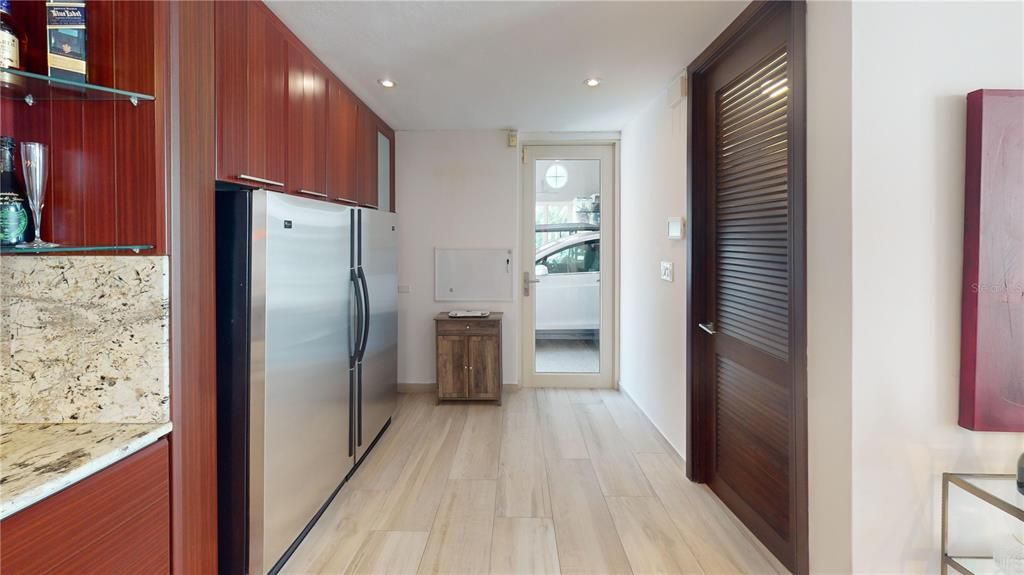 Kitchen, door to Garage and the pantry door on the right side.